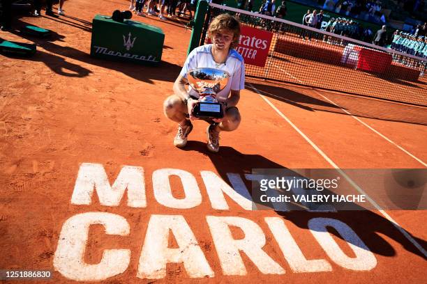 Russia's Andrey Rublev celebrates with his trophy after winning the final Monte-Carlo ATP Masters Series tournament tennis match against Denmark's...