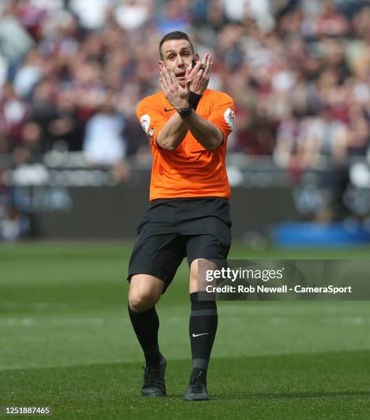 Referee David Coote during the Premier League match between West Ham United and Arsenal FC at London Stadium on April 16, 2023 in London, United...