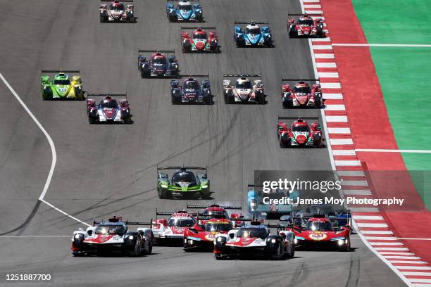 The Toyota Gazoo Racing GR010 Hybrid of Sebastien Buemi, Brendon Hartley, and Ryo Hirakawa and the Toyota Gazoo Racing Toyota GR010 Hybrid of Mike...