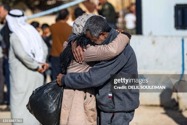 Man, suspected of having collaborated with the Islamic State group, is greeted by a relative upon being released from the Kurdish-run Alaya prison in...