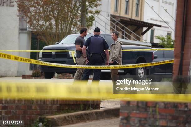 Investigators work the crime scene following a shooting on April 16, 2023 in Dadeville, Alabama. According to reports, at least four people were...