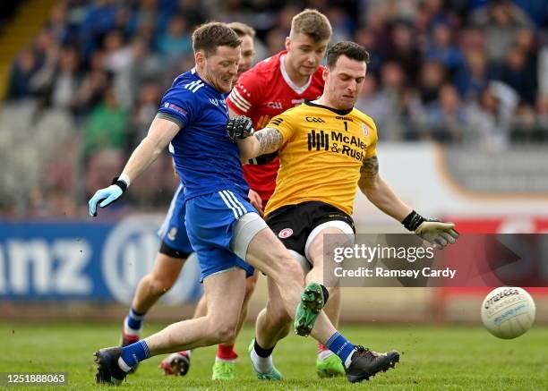 Tyrone , United Kingdom - 16 April 2023; Conor McManus of Monaghan shoots at goal under pressure from Tyrone goalkeeper Niall Morgan during the...