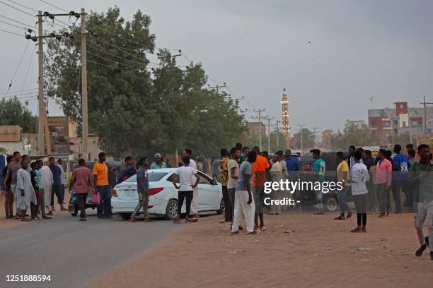 People gather on the street in east Khartoum on April 16 as fighting in Sudan raged for a second day in battles between rival generals. Sudan's army...