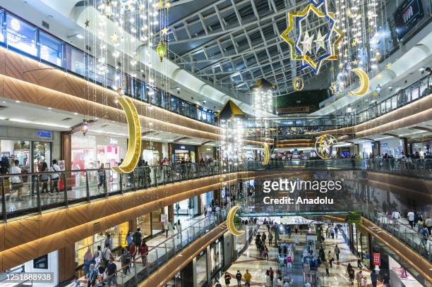 People visit the shopping mall to buy new clothes for Eid al Fitr in Jakarta, Indonesia on April 16, 2023. Muslims around the world prepare to...