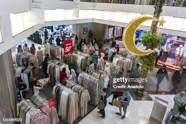 People visit the shopping mall to buy new clothes for Eid al Fitr in Jakarta, Indonesia on April 16, 2023. Muslims around the world prepare to...