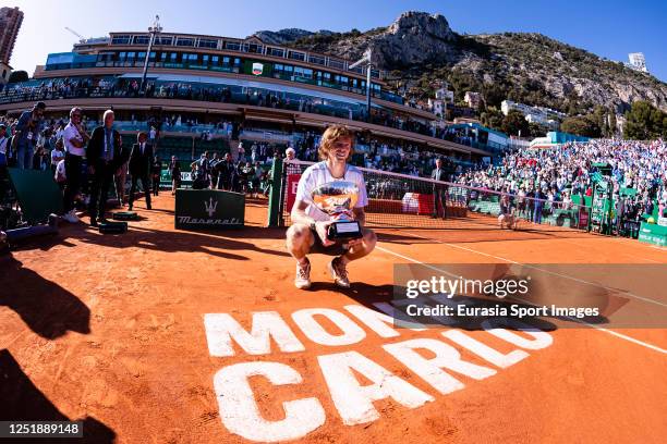 Monte-Carlo Masters winner Andrey Rublev poses for photos with the Champion trophy after defeating Holger Rune of Denmark during day eight of the...