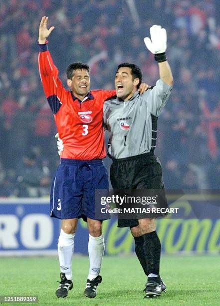 Ronald Fuentes and Nelson Tapia of Chile celebrate after defeating Brazil in their World Cup 2002 tournament game in Santiago, Chile 15 August 2000....