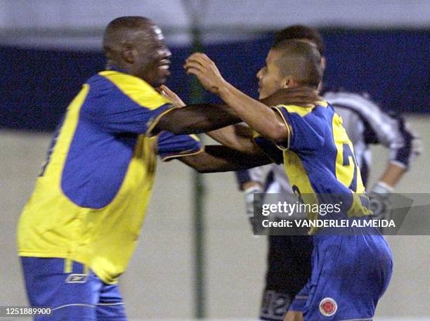 Faustino Asprilla and Rafael Castillo celebrate their fourth goal against Paraguay in Asuncion, Paraguay 14 November 2001. Los jugadores de la...