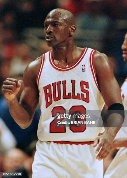 Michael Jordan , guard for the Chicago Bulls, pumps his fist in the second quarter of the game against the New York Knicks 14 May at the United...