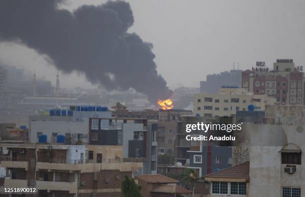 Smoke rises as clashes continue in the Sudanese capital on April 16, 2023 between the Sudanese Armed Forces and the paramilitary Rapid Support Forces...