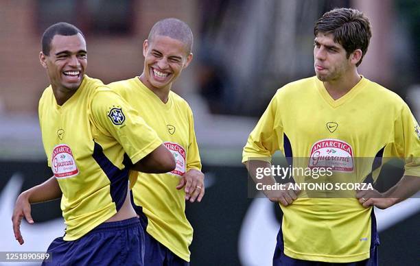 Soccer players Denilson , Alex and Juninho Pernambucano , of the Brazil socccer team joke 20 July, 2001 during practice in Cali, Colombia. Brazil...