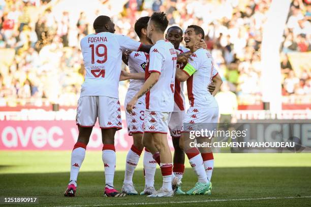 Monaco's French forward Wissam Ben Yedder celebrates with Monaco's French midfielder Youssouf Fofana and teamates after Monaco's third goal during...