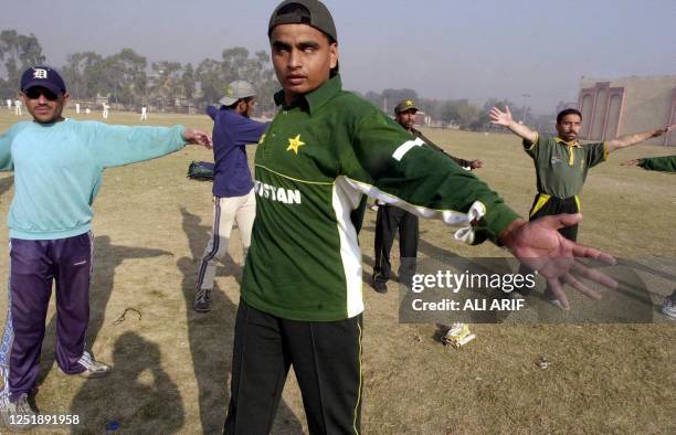 Pakistan's national blind cricket team members warm up during their practice session in Lahore, 29 November 2002. The national blind cricket team is...