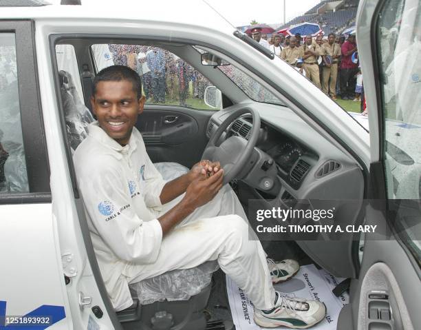 West Indies' Shivnarine Chaderpaul gets in his new car after being named "Man of the Series" during the 2002 fifth and final Test Match Cricket...