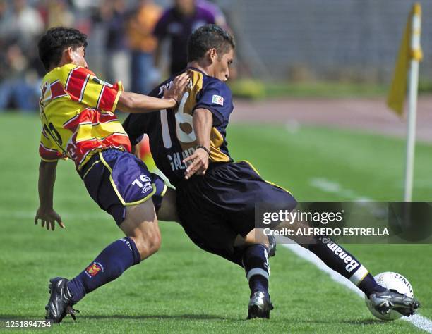 Pumas player Gerardo Galindo , takes the ball from Eduardo Rodriguez , of Morelia, during the quarter finals of the summer tournament for the Mexican...