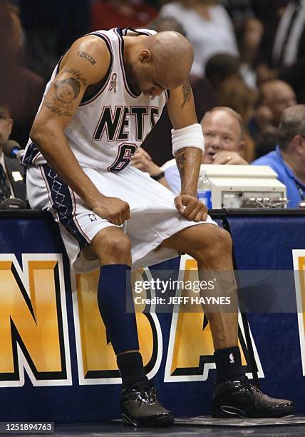 Kenyon Martin of the New Jersey Nets sits at the scorers' table during the final seconds of game four in the NBA Finals against the Los Angeles...