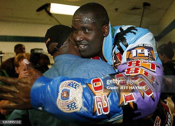 Los Angeles Lakers Shaquille O'Neal hugs his father in the locker room after game four of the NBA Finals against the New Jersey Nets at Continental...