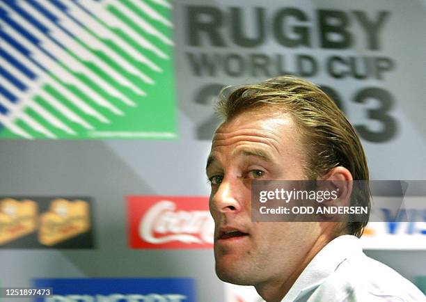 Australian flyhalf Chris Whitaker leaves a press conference in Coffs Harbour, 22 October 2003 after coach Eddie Jones announced his captaincy for the...