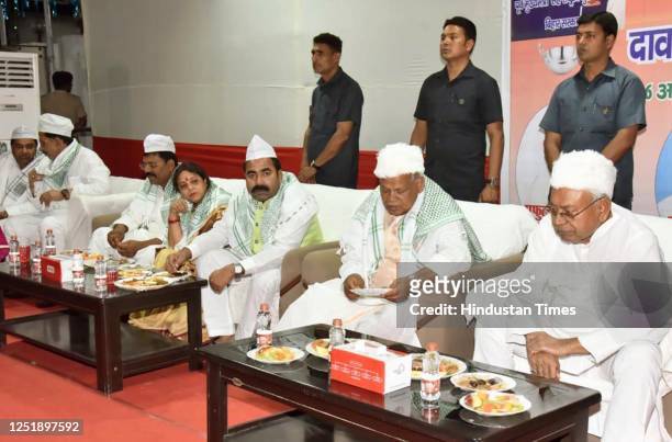 Bihar Chief Minister Nitish Kumar with HAM party founder Jitanram Manjhi during an Iftar party at Manjhi's residence on April 16, 2023 in Patna,...