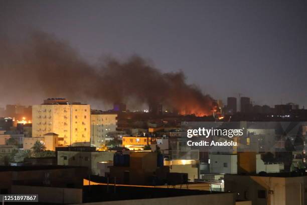 Smoke rises as clashes continue in the Sudanese capital on April 16, 2023 between the Sudanese Armed Forces and the paramilitary Rapid Support Forces...