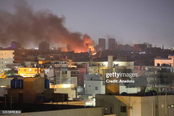 Smoke rises as clashes continue in the Sudanese capital on April 16, 2023 between the Sudanese Armed Forces and the paramilitary Rapid Support Forces...