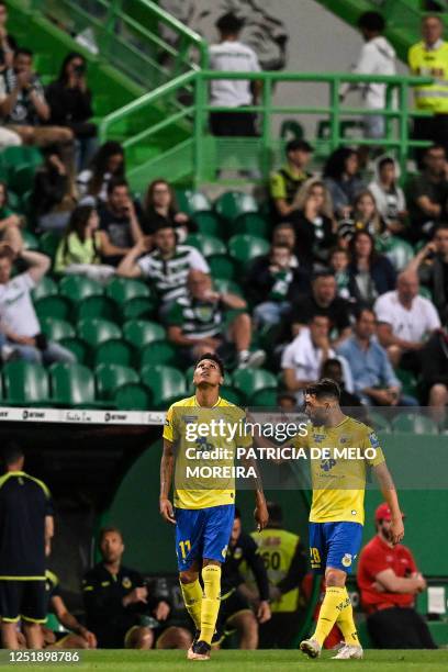 Arouca's Brazilian forward Antony Alves celebrates with teammates after scoring his team's first goal during the Portuguese league football match...