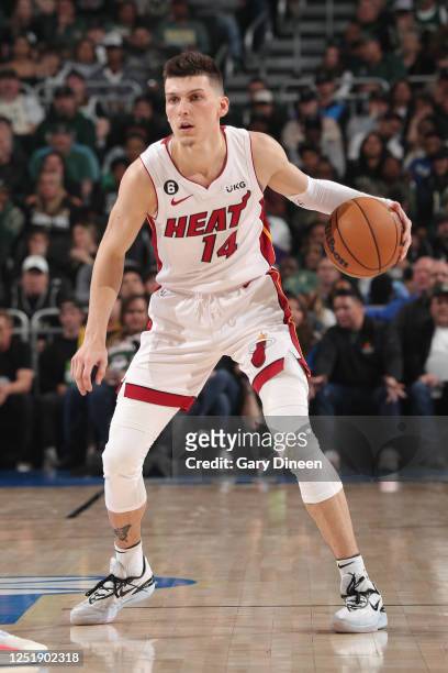 Tyler Herro of the Miami Heat dribbles the ball during the game against the Milwaukee Bucks during Round One Game One of the 2023 NBA Playoffs on...