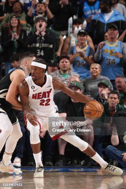 Jimmy Butler of the Miami Heat handles the ball during the game against the Milwaukee Bucks during Round One Game One of the 2023 NBA Playoffs on...
