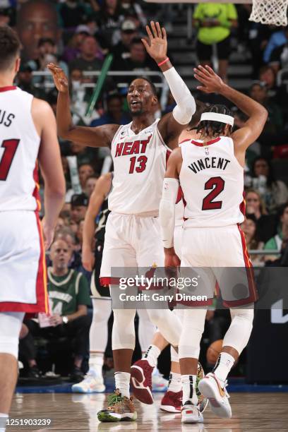 Bam Adebayo of the Miami Heat high fives during the game against the Milwaukee Bucks during Round One Game One of the 2023 NBA Playoffs on April 16,...