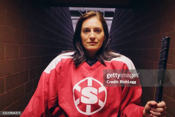 woman hockey player - hockey jersey stock pictures, royalty-free photos & images