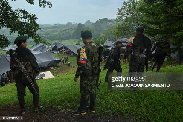 Dissidents attend a meeting with local communities in San Vicente del Caguan, Caqueta department, Colombia on April 16, 2023. - An armed dissident...