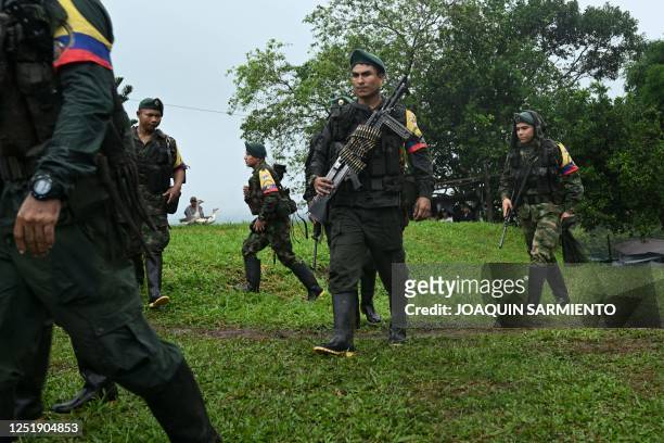 Dissidents attend a meeting with local communities in San Vicente del Caguan, Caqueta department, Colombia on April 16, 2023. - An armed dissident...