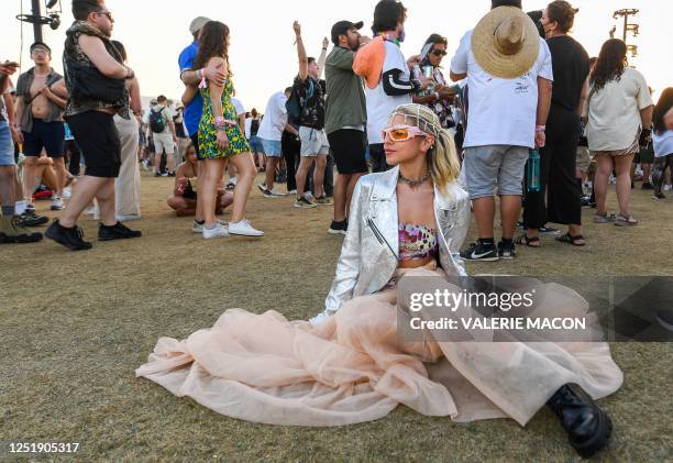 Rosalia's fan Lizzi Kapran listens to her performance during the first week-end of the Coachella Valley Music and Arts Festival, in Indio,...