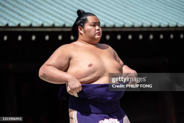 Sumo wrestler attends the inner courtyard worship after the ceremonial sumo exhibition match "votive grand sumo tournament" at Yasukuni Shrine in...