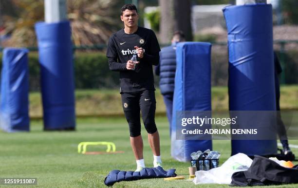 Chelsea's Brazilian defender Thiago Silva attends a team training session at Chelsea's Cobham training facility in Stoke D'Abernon, southwest of...