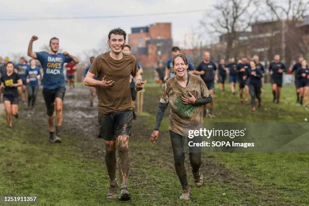 Participants take part in Tough Mudder race in Finsbury Park, London. Tough Mudder was co-founded by Will Dean and Guy Livingstone and the race...