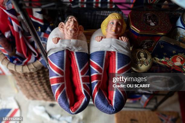 Pair of Prince Charles and Lady Diana themed slippers are displayed amongst the 13,283 pieces of royal memorabilia which ardent monarchist Anita...