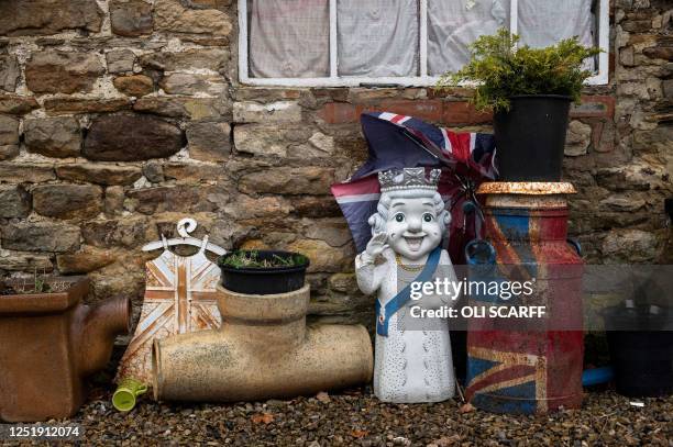 Caricatured figure of Queen Elizabeth II is displayed outside the building containing the 13,283 pieces of royal memorabilia which ardent monarchist...