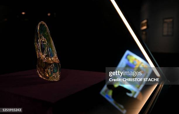 The glass slipper from the Disney film "Cinderella" is presented at the "Disney 100 - The Exhibition" show in the small Olympic hall in Munich,...