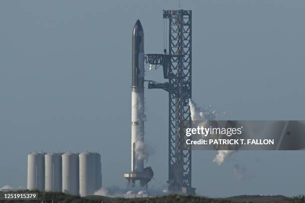 The SpaceX Starship rocket stands on the launchpad from the SpaceX Starbase in Boca Chica as seen from South Padre Island, Texas on April 17, 2023....