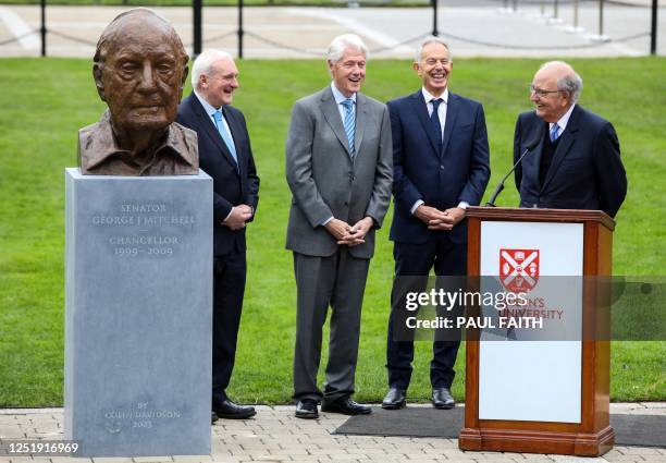 Former Talks Chairman and US Senator George Mitchell delivers a speech following the unveiling of a bust statue at his image, by former US President...