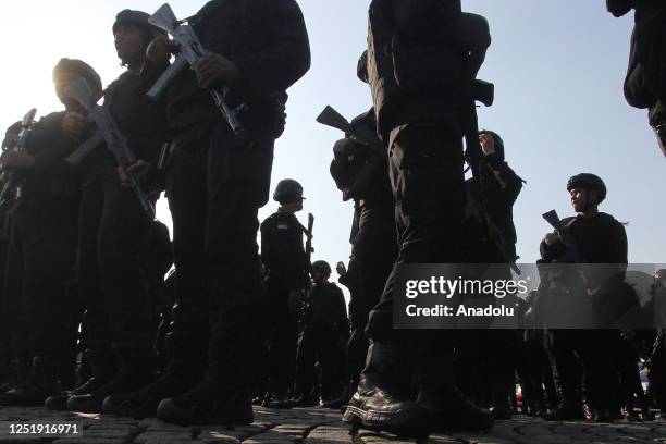 Police officers attend a ceremony during security preparation ahead of Eid al-Fitr celebrations in Jakarta, Indonesia on April 17, 2023. According to...