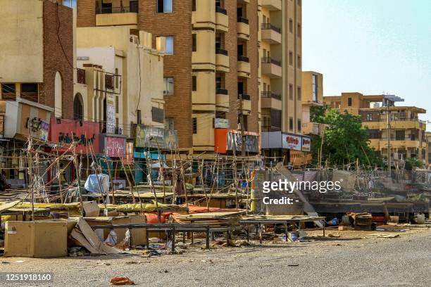 Vendors' stalls are abandoned along a street market in the south of Khartoum on April 17, 2023 as fighting in the Sudanese capital between the army...