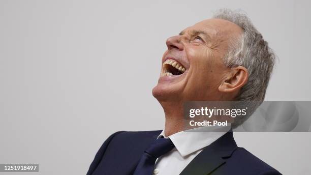 Former British Prime Minister, Sir Tony Blair laughs while on stage on the first day of a three-day conference to mark the 25th anniversary of the...