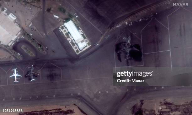 Maxar closeup satellite imagery of incinerated passenger planes at the Khartoum international Airport, Sudan.. Please use: Satellite image 2023 Maxar...