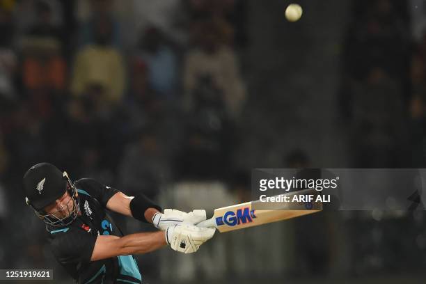 New Zealand's Will Young plays a shot during the third Twenty20 international cricket match between Pakistan and New Zealand at the Gaddafi Cricket...