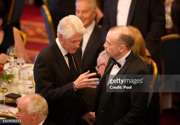 Former US President Bill Clinton meets with Secretary of State for Northern Ireland Chris Heaton-Harris at a banquet on the first day of a three-day...