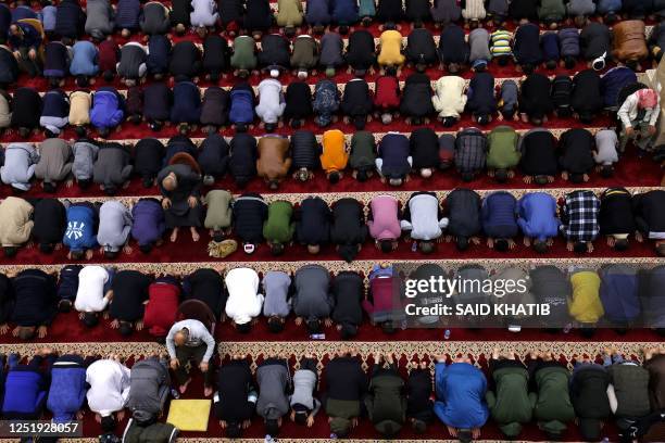 Palestinian worshippers pray at Al-Awda mosque during the Muslim holy month of Ramadan in Rafah town in the southern, on April 17 - on the night of...