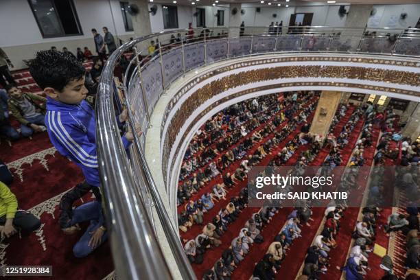 Palestinian worshippers pray at Al-Awda mosque during the Muslim holy month of Ramadan in Rafah town in the southern, on April 17 - on the night of...