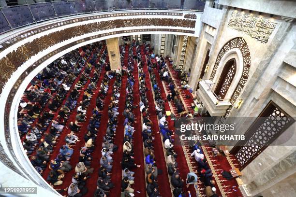 Palestinian worshippers pray at Al-Awda mosque during the Muslim holy month of Ramadan in Rafah town in the southern, on April 17 - on the night of...